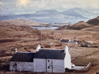 A view out to the sea across a small township